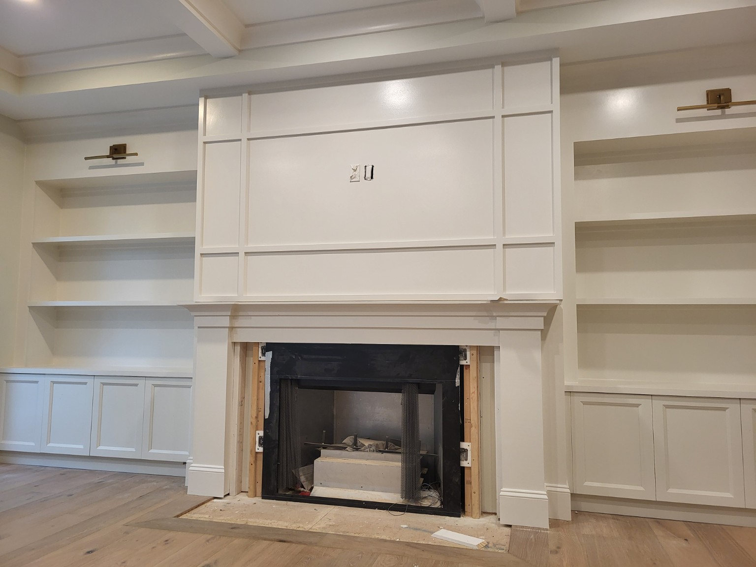 Custom shelving and fireplace surround