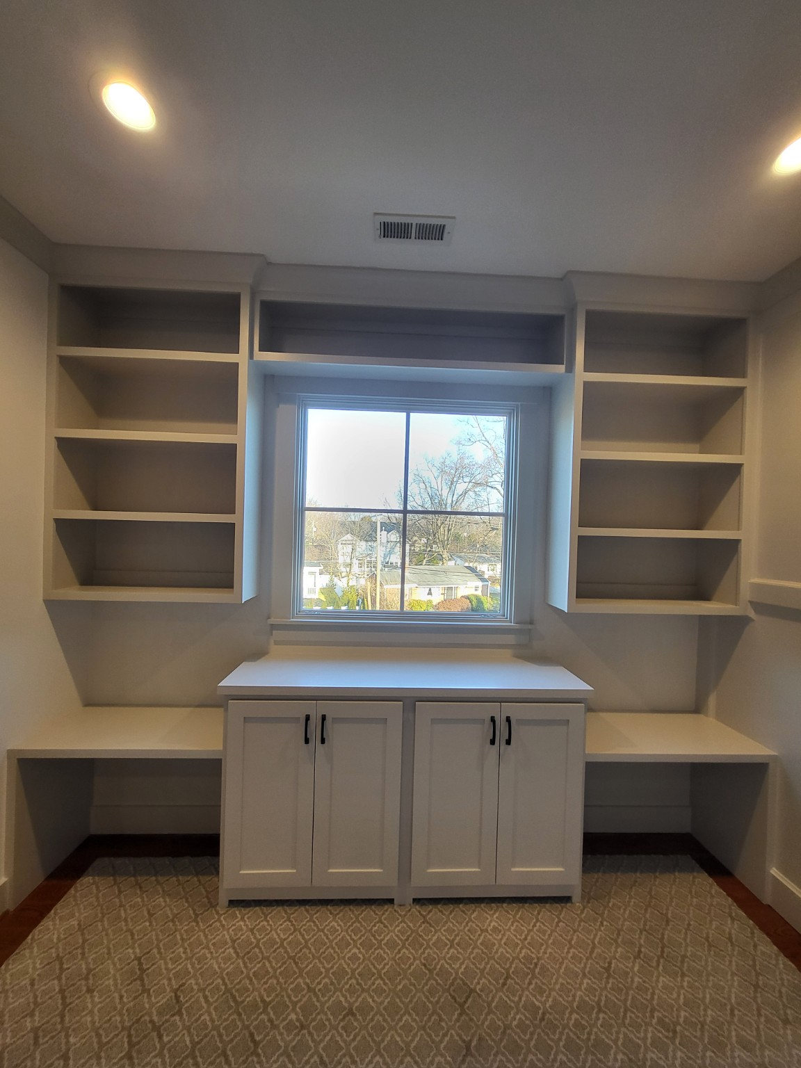 Custom children's homework station with built-in cabinetry and storage