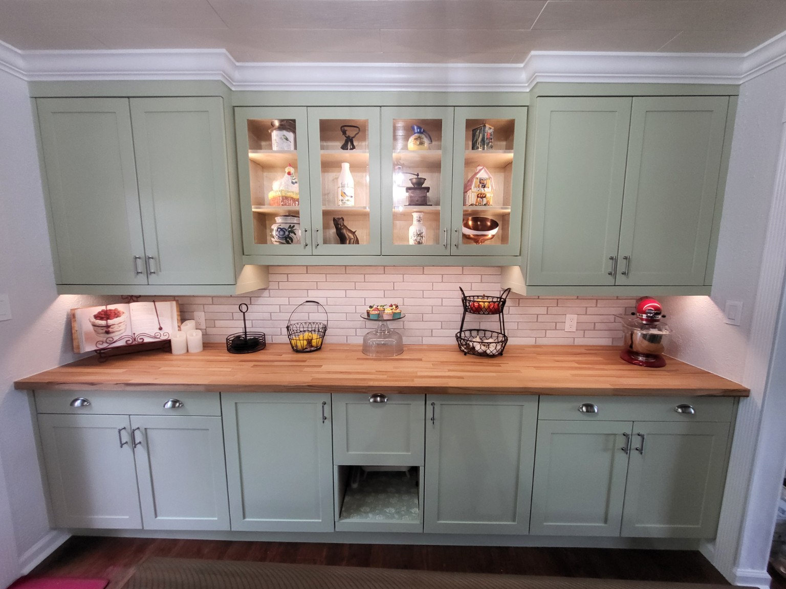 Custom kitchen cabinetry and butcher-block countertop detail