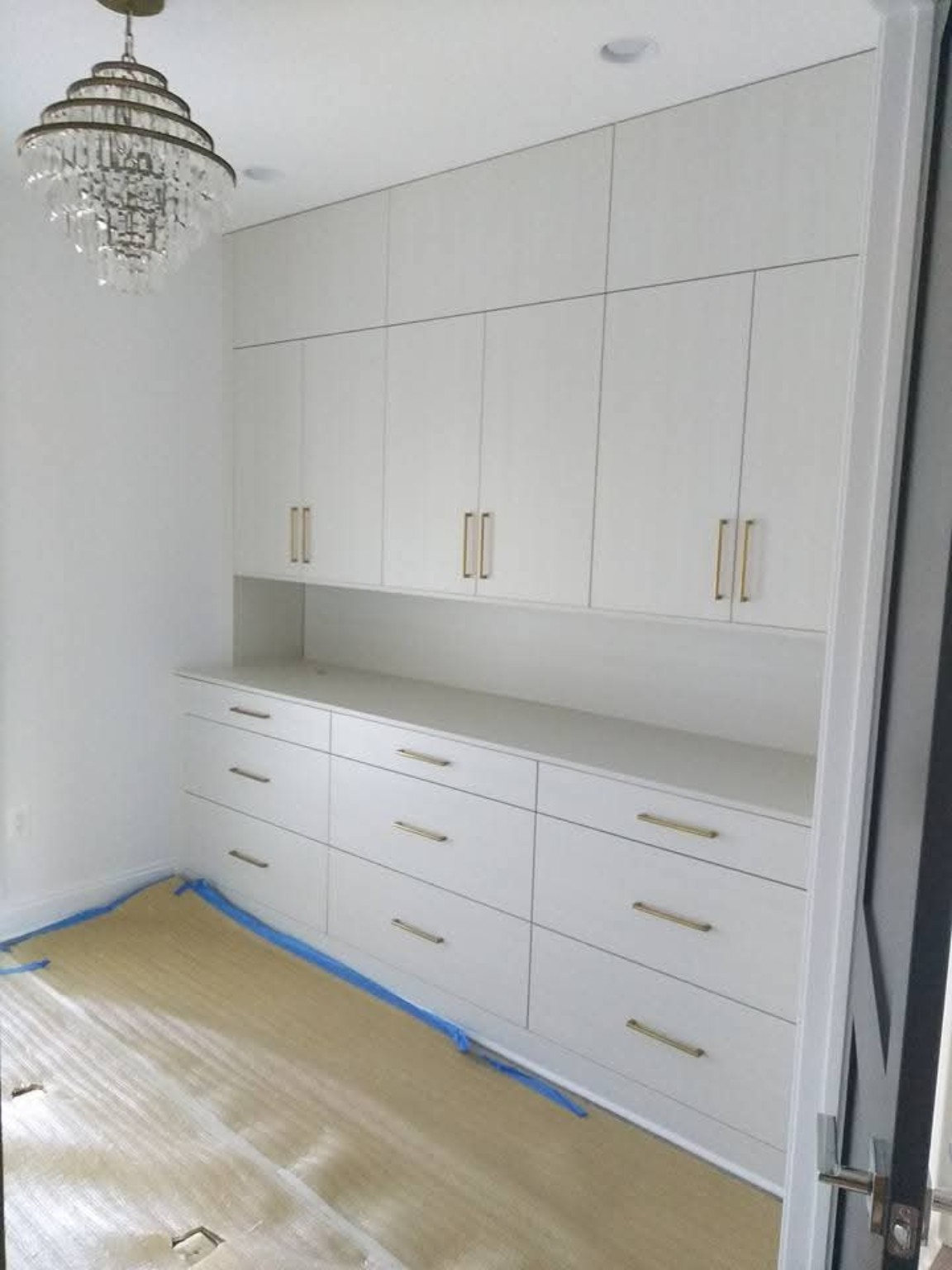 White cabinetry with gold hardware