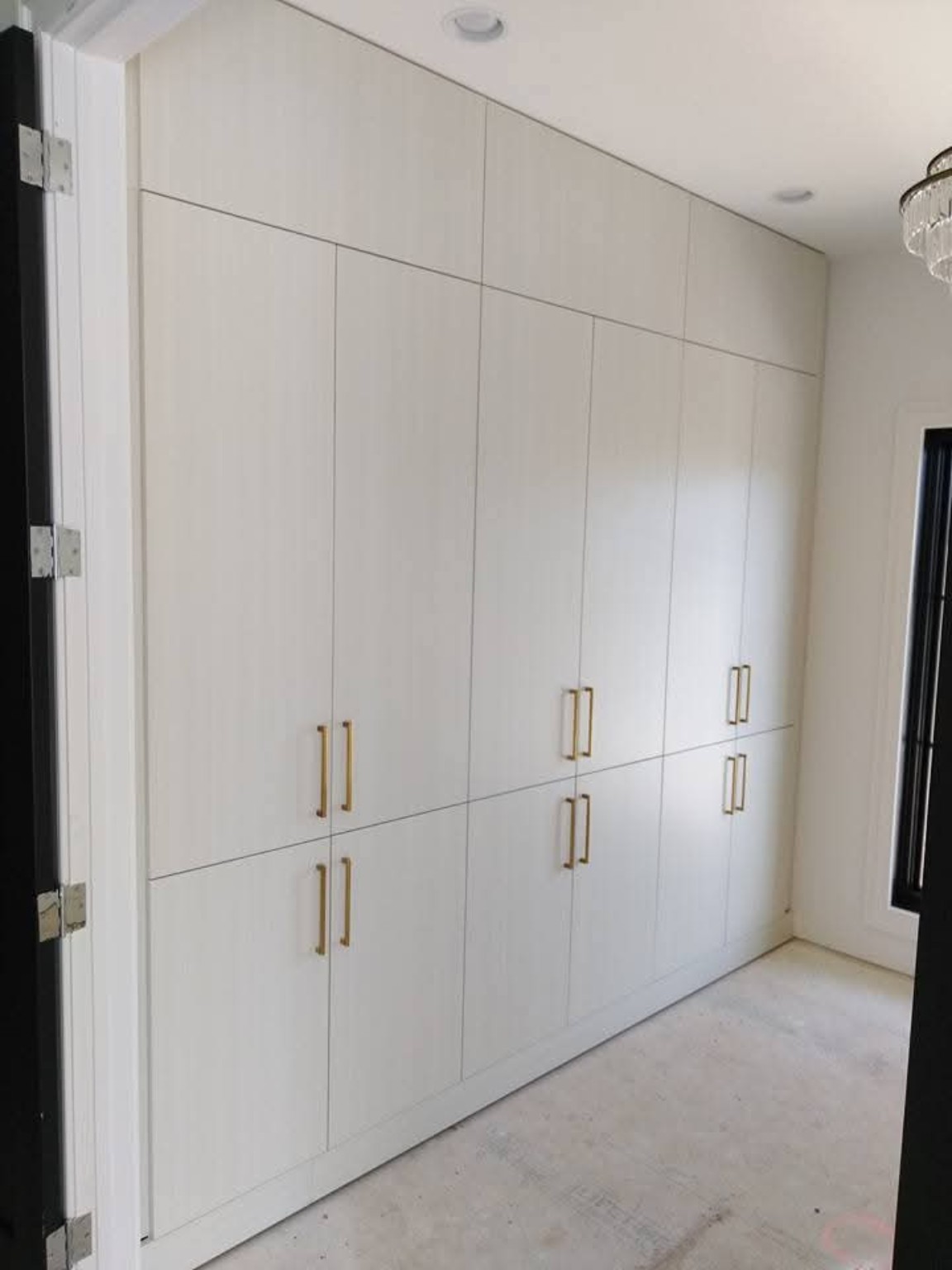 Full-height white storage cabinetry