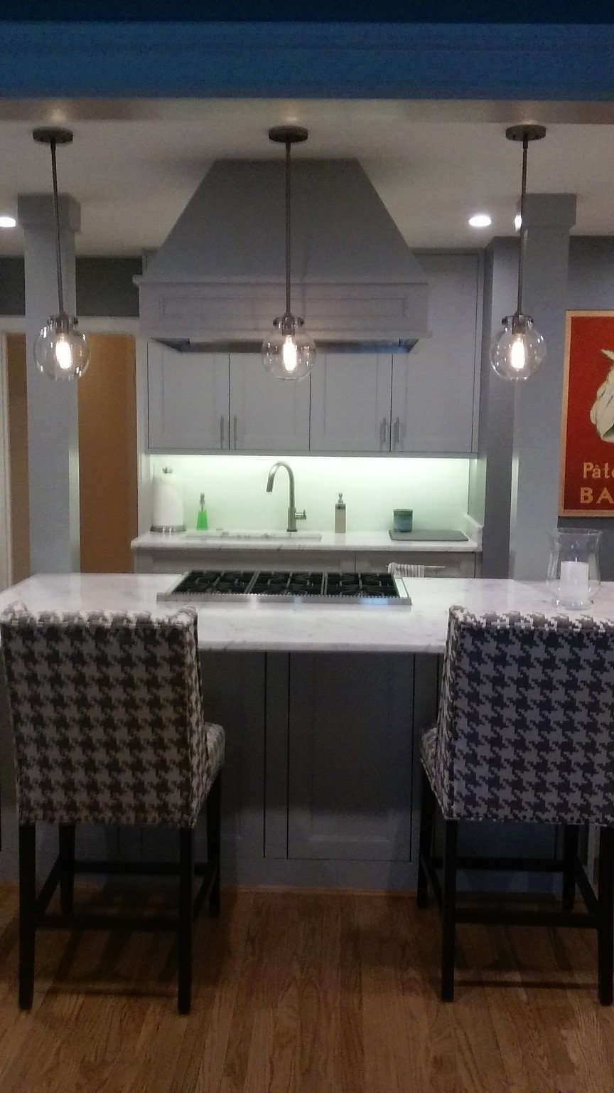 Gray kitchen with custom hood